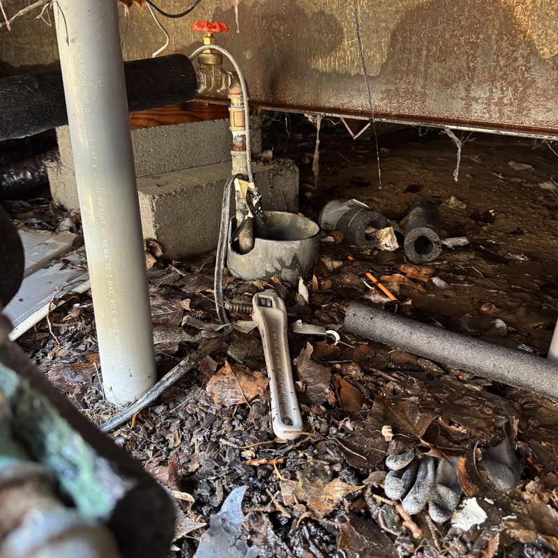 Main water shutoff valve and PEX piping in crawl space Main water shutoff valve and PEX piping in crawl space