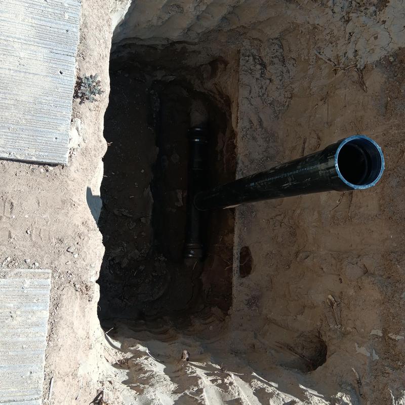 Polyethylene sewer pipe installation in trench Polyethylene sewer pipe installation in trench