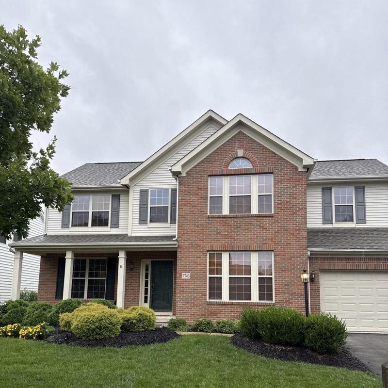 Soffit vents and gutters on two-story brick house Soffit vents and gutters on two-story brick house