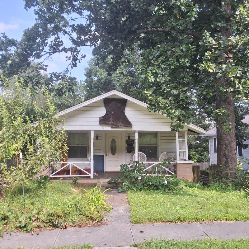 House roof with front porch and yard in Johnson City TN