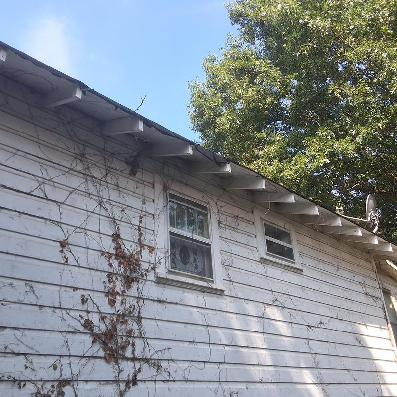 Roof eaves and soffit inspection on home exterior