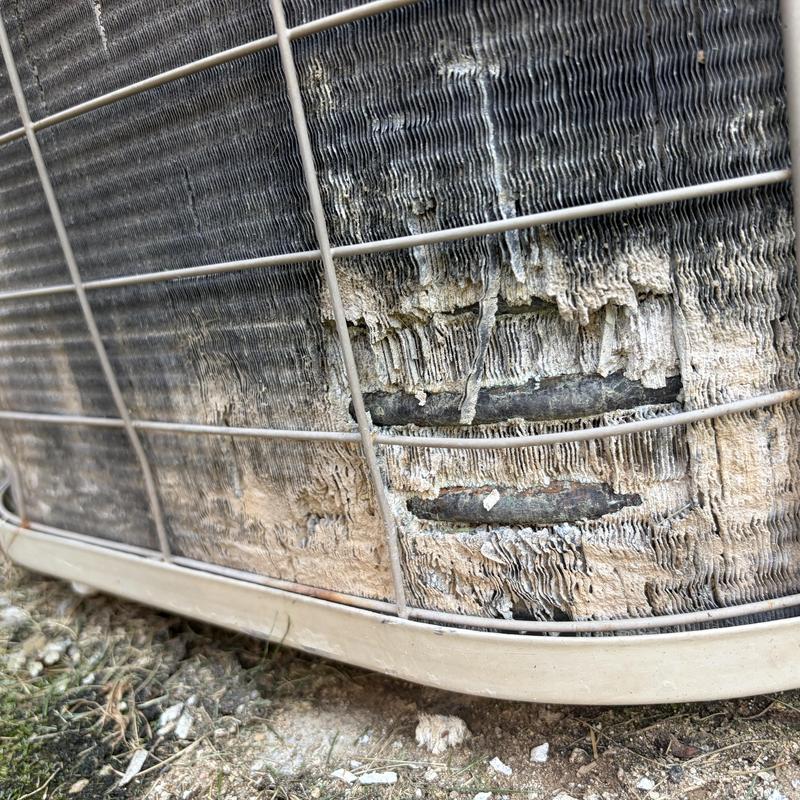 Outdoor AC condenser coil rust and damage close-up Outdoor AC condenser coil rust and damage close-up