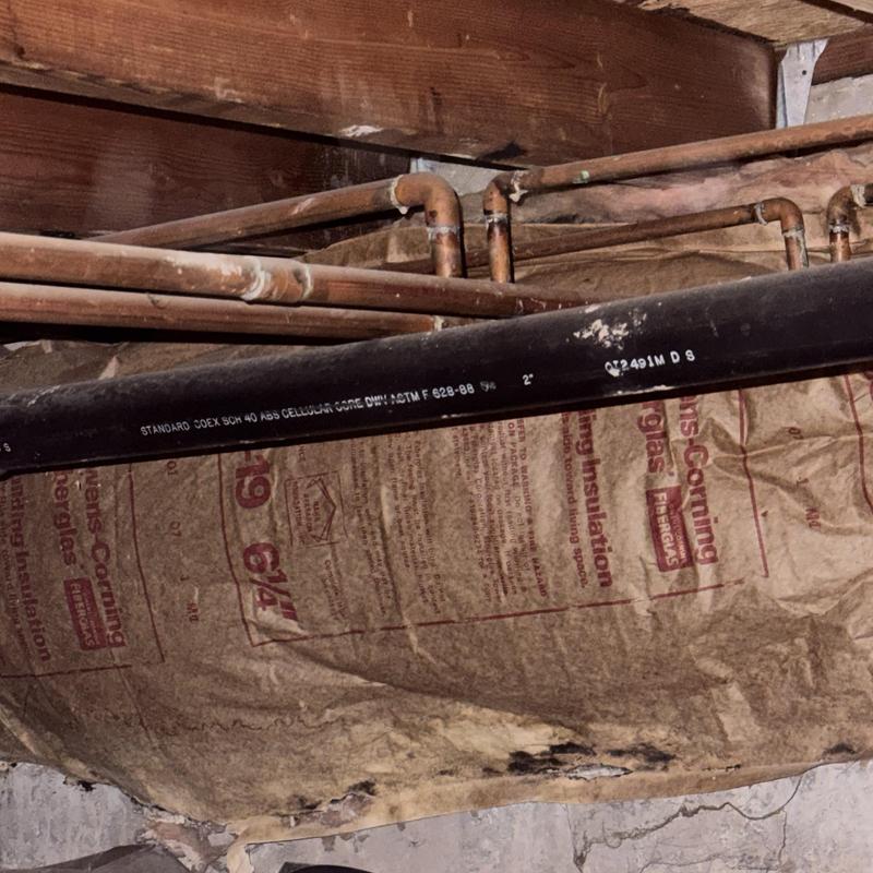 Copper piping with corroded joints and insulation damage