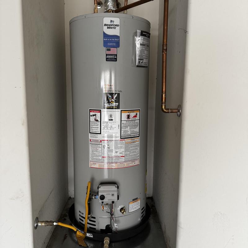 Bradford White water heater installation in utility closet