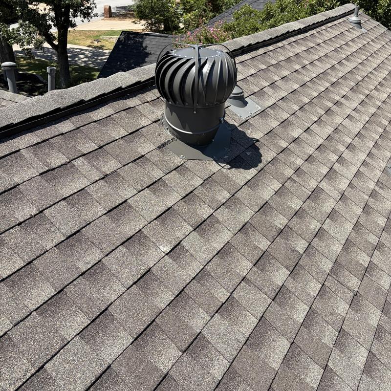Roof turbine vent on asphalt shingle roof