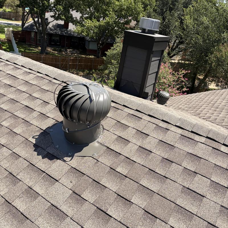 Attic turbine ventilator on shingled roof