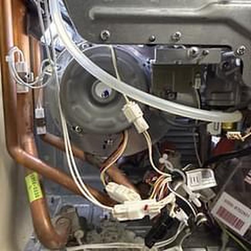 Water heater fan blower assembly with wiring and pipes