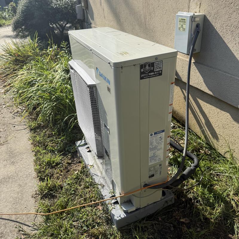Daikin outdoor heat pump unit with electrical disconnect box Daikin outdoor heat pump unit with electrical disconnect box