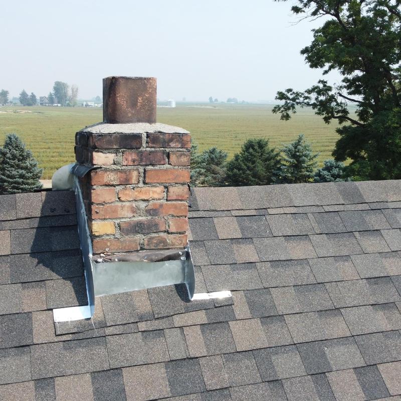 Chimney flashing on asphalt shingle roof installation Chimney flashing on asphalt shingle roof installation