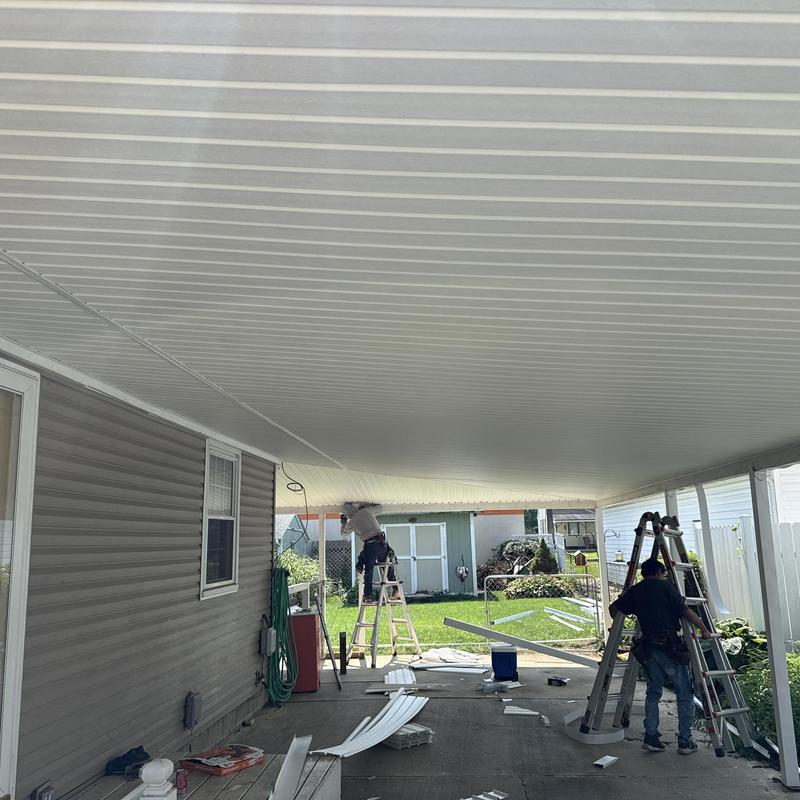 Vinyl soffit installation under covered patio