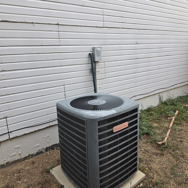 Goodman air conditioner unit outside home