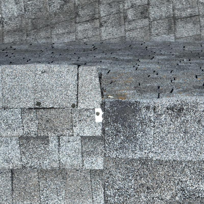 Asphalt shingle roof with hail damage and wear