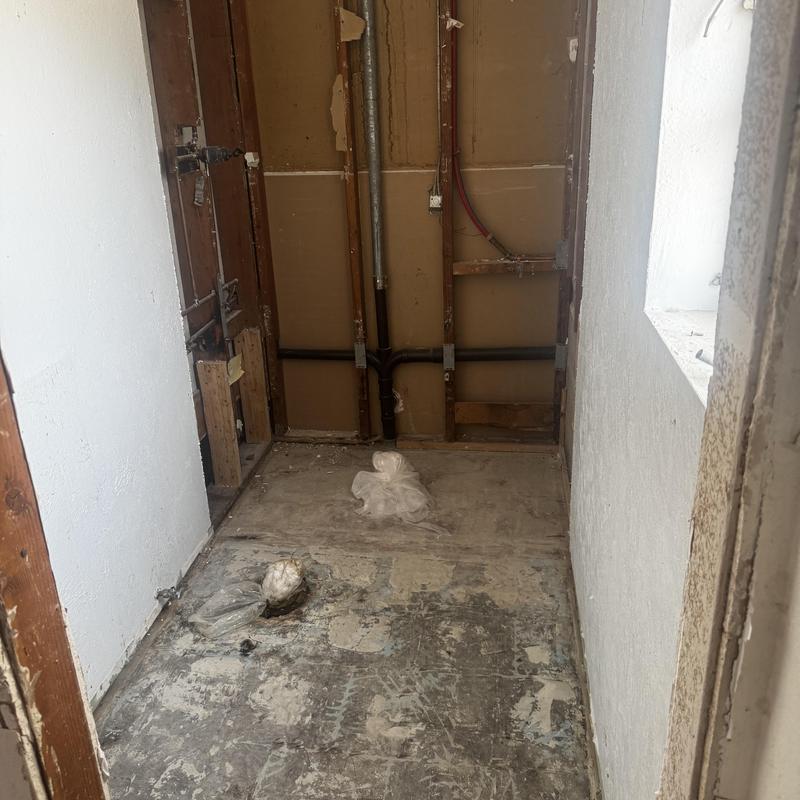 Sewer line and plumbing rough-in in bathroom remodel space Sewer line and plumbing rough-in in bathroom remodel space
