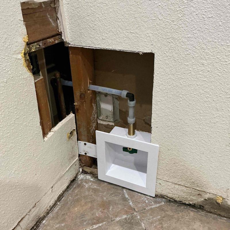 Ice maker box and water pipe installation behind wall