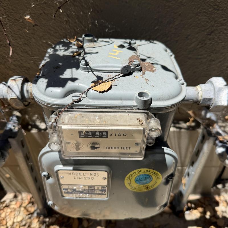 Gas meter with connected piping and fittings installed