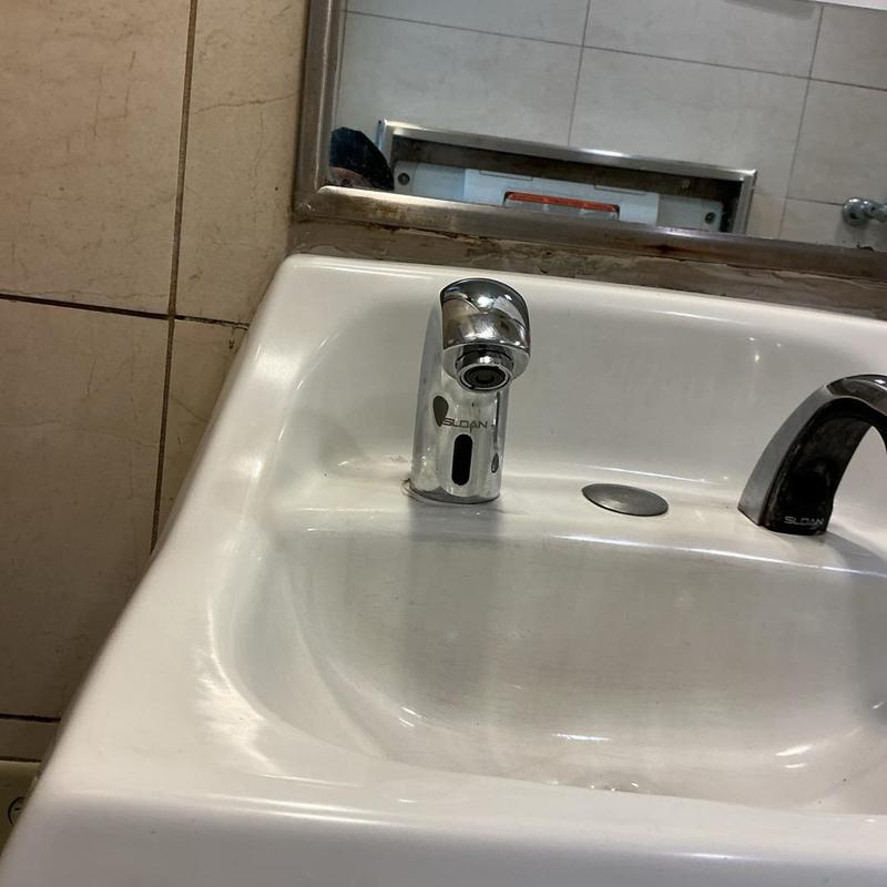 Sloan sensor faucet on men's bathroom sink Sloan sensor faucet on men's bathroom sink