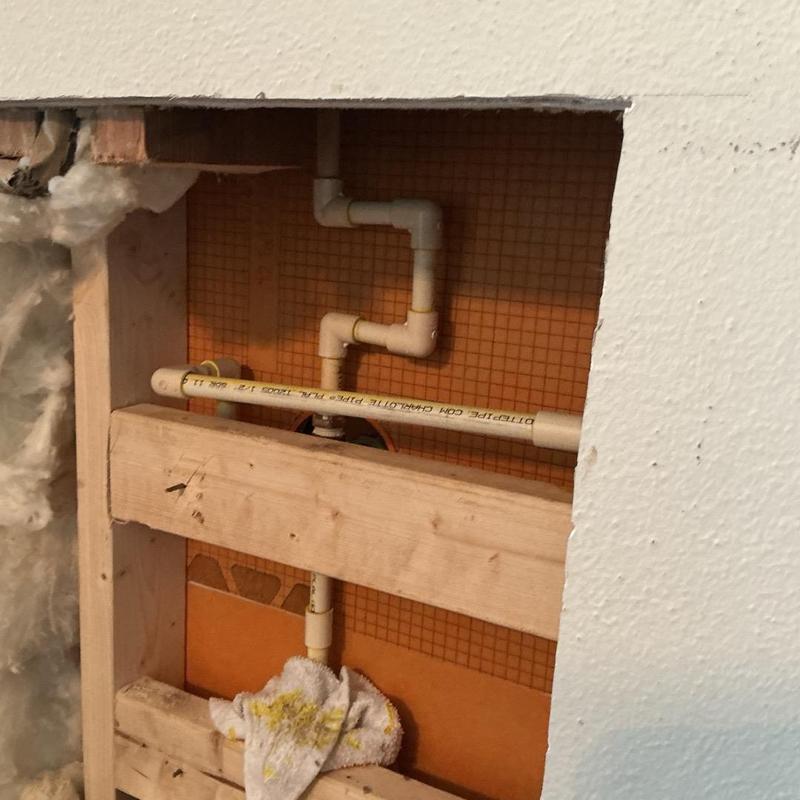 Shower valve with rerouted PVC pipes in wall cavity Shower valve with rerouted PVC pipes in wall cavity