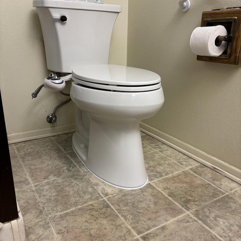 Kohler toilet with installed seat bidet and caulking