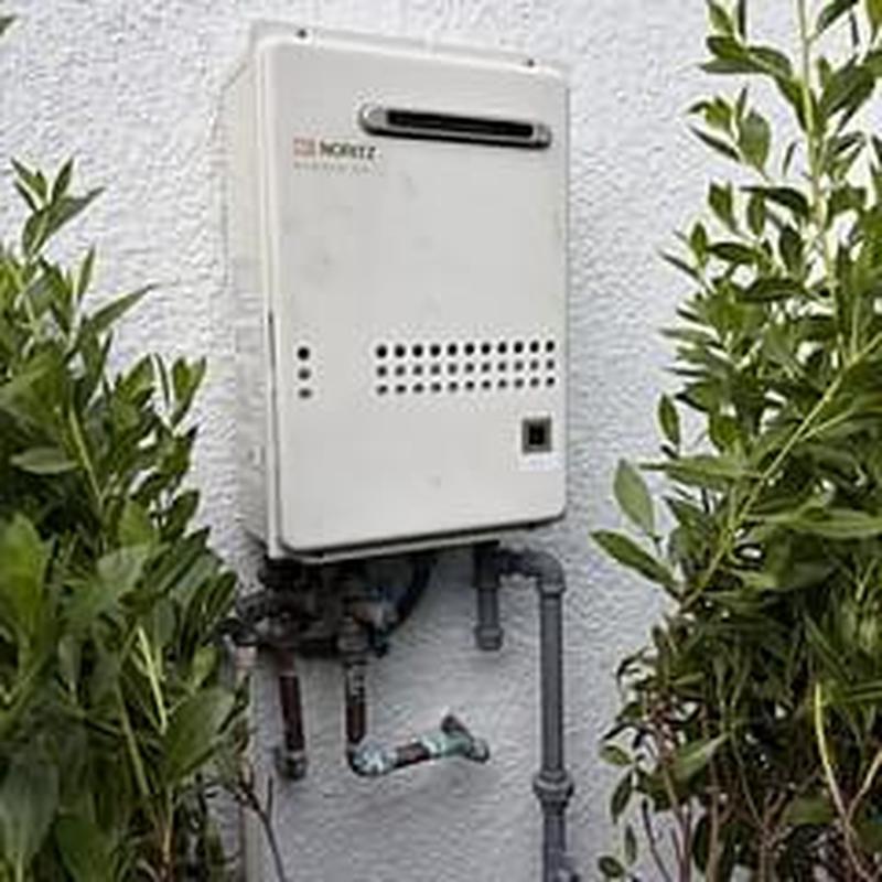 Noritz tankless gas water heater on exterior wall