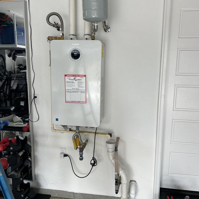 Tankless water heater with venting and piping Tankless water heater with venting and piping