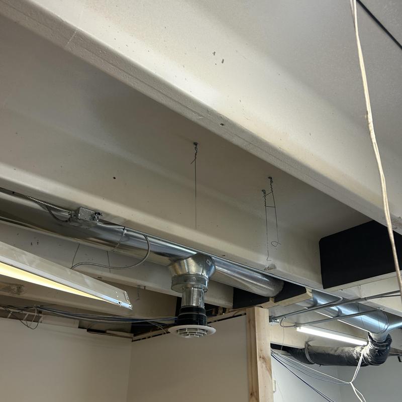 Commercial light fixtures and ductwork in ceiling installation Commercial light fixtures and ductwork in ceiling installation