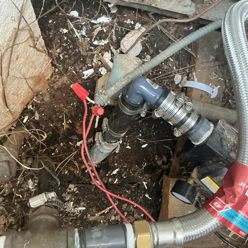 Well pressure switch with piping and hose clamps