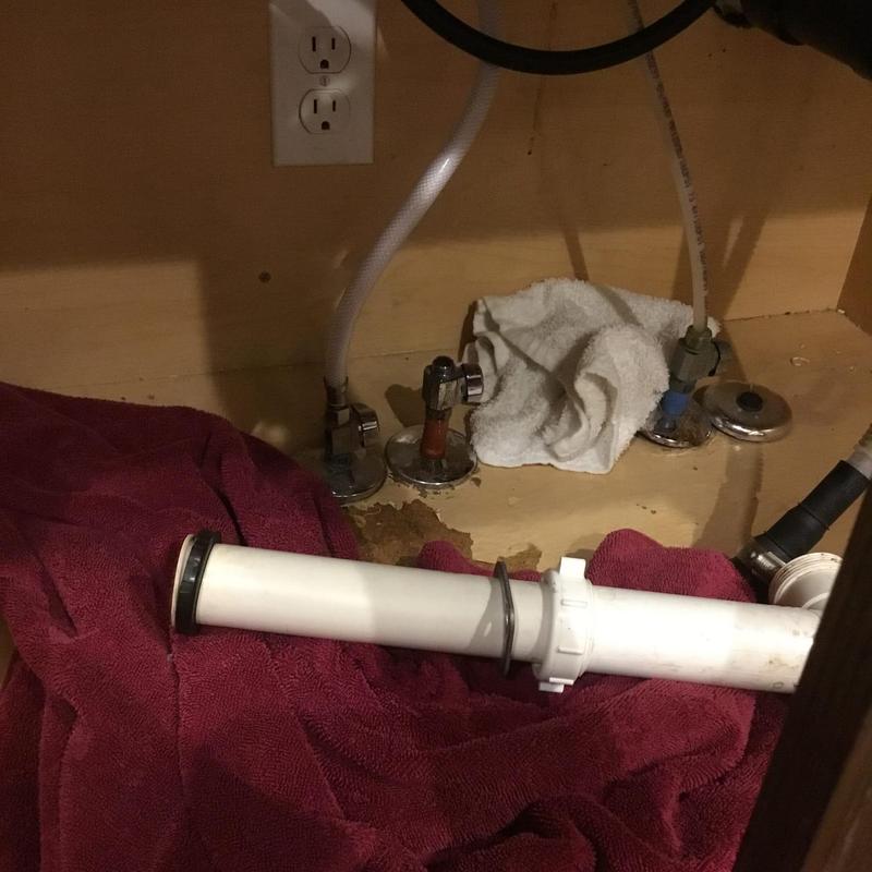 Angle stop valves under kitchen sink with plumbing pipe