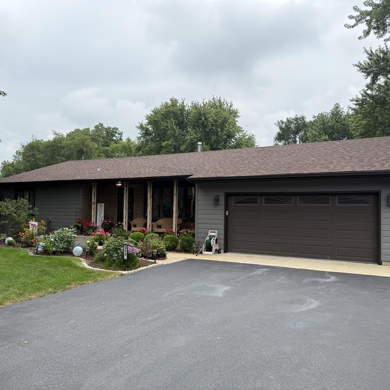 Composite insulated siding and garage facade installation