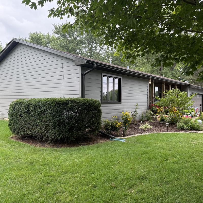 Composite insulated siding with soffit and fascia, gutters