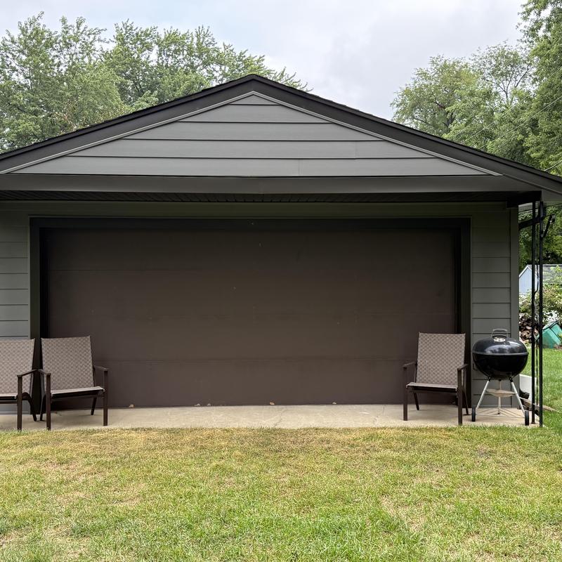 Composite insulated siding and soffit on garage exterior