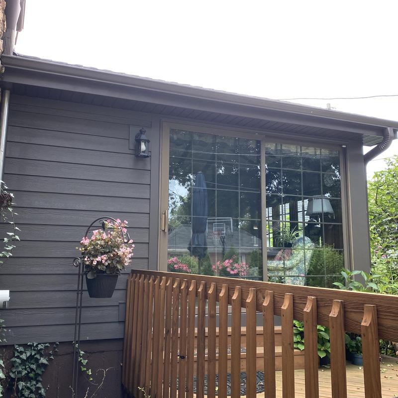 Gutter and downspout system on house exterior