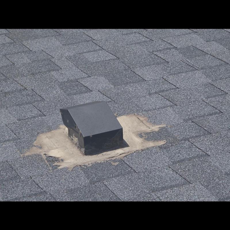 Roof vent pipe with patched roof shingles Roof vent pipe with patched roof shingles