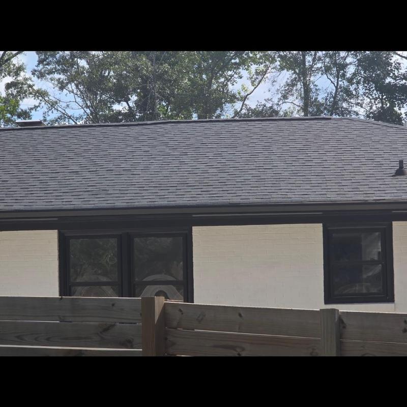 Asphalt shingle roof with visible wood fence in Simpsonville Asphalt shingle roof with visible wood fence in Simpsonville