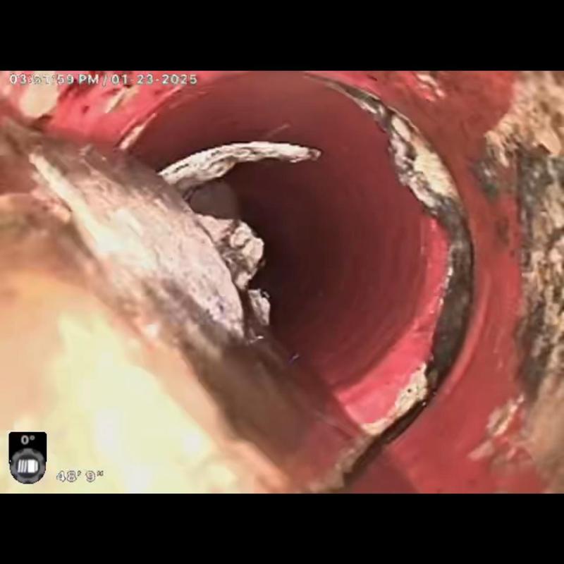 Sewer lateral with grease buildup inspection camera view
