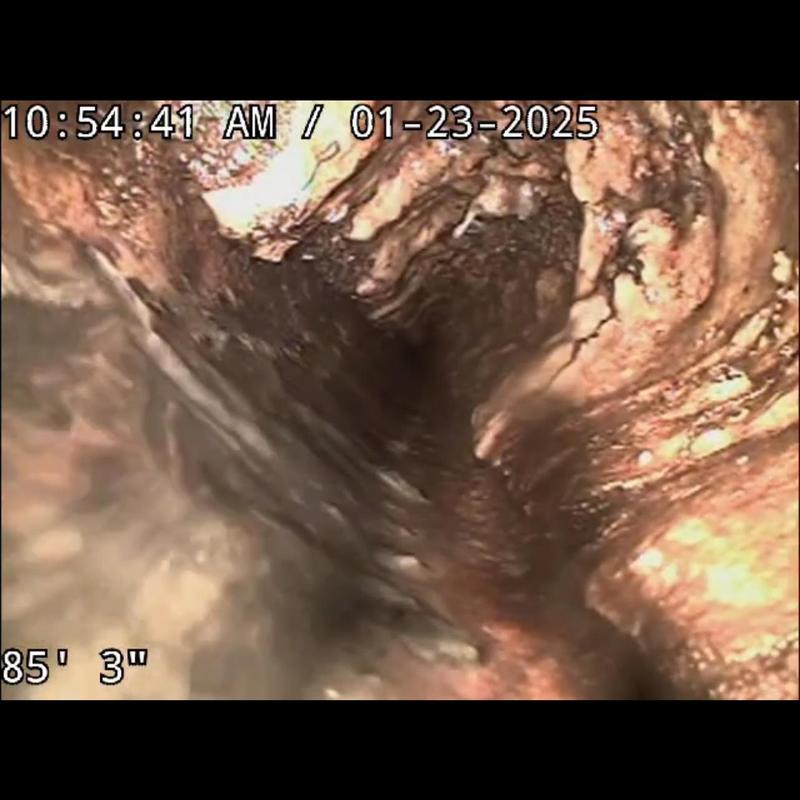 Sewer lateral inspection showing grease buildup