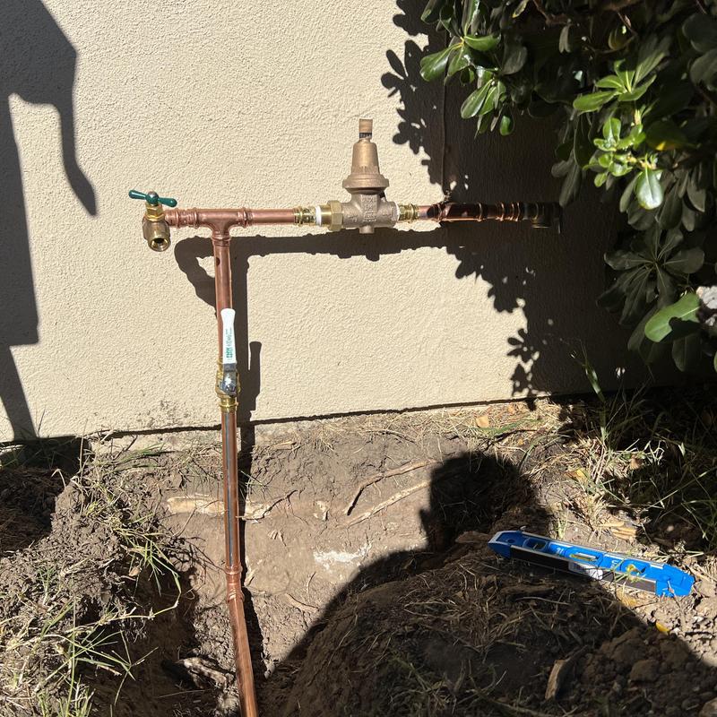 Type L copper water line with pressure regulator and valve