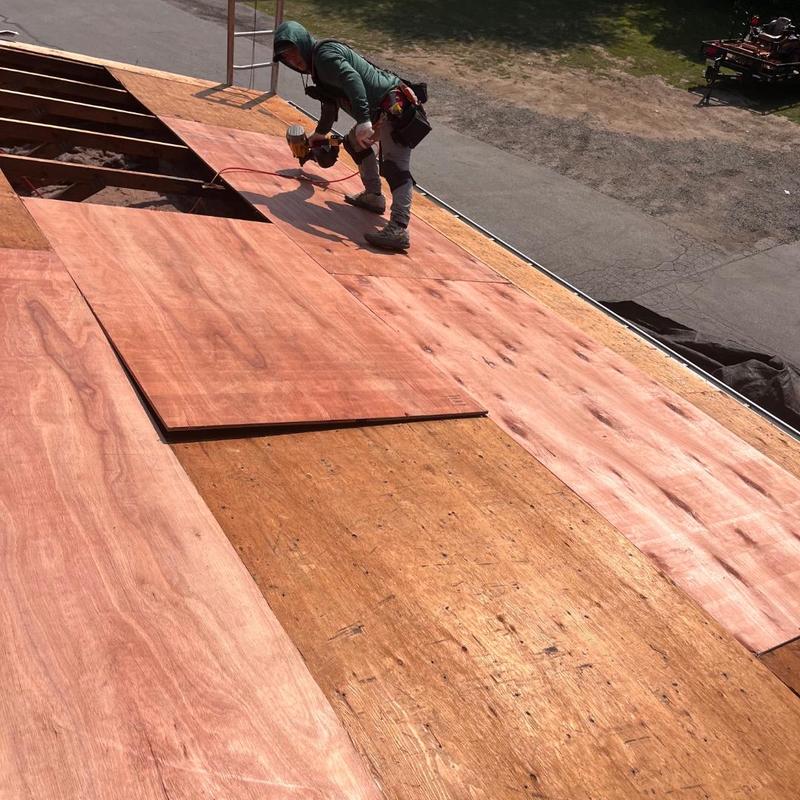 Plywood roof deck installation on residential roof Plywood roof deck installation on residential roof