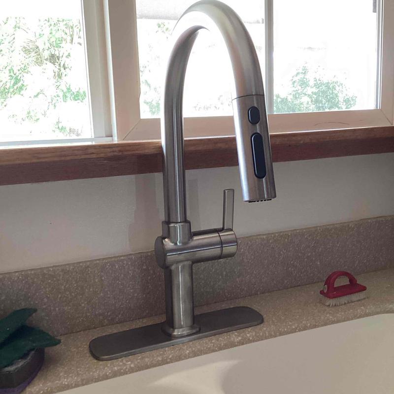 Kitchen faucet with sprayer on countertop