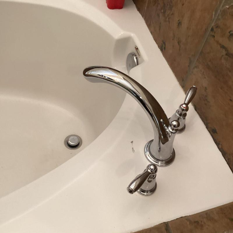 Roman tub faucet installation on bathtub edge