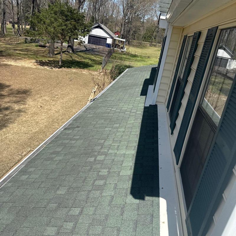 Asphalt shingle roof with hail damage inspection
