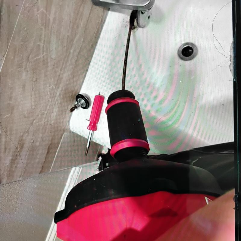 Shower handle with drain snake and screwdriver tools