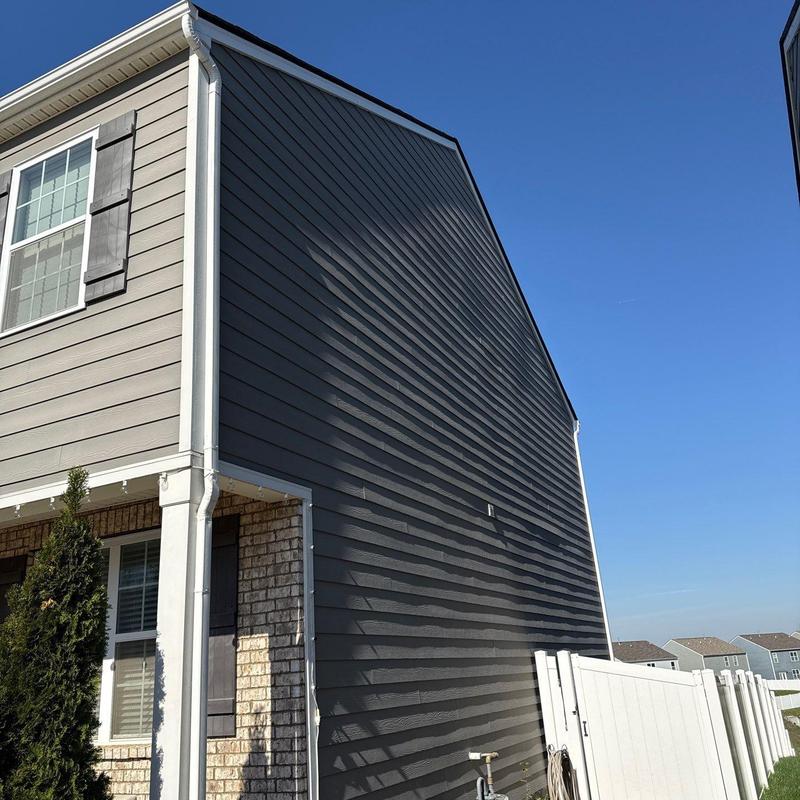 Vinyl siding damage on residential corner exterior