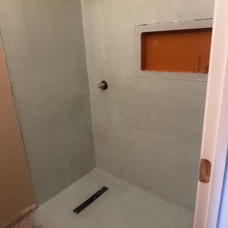 Shower waterproofing membrane applied before tile installation Shower waterproofing membrane applied before tile installation