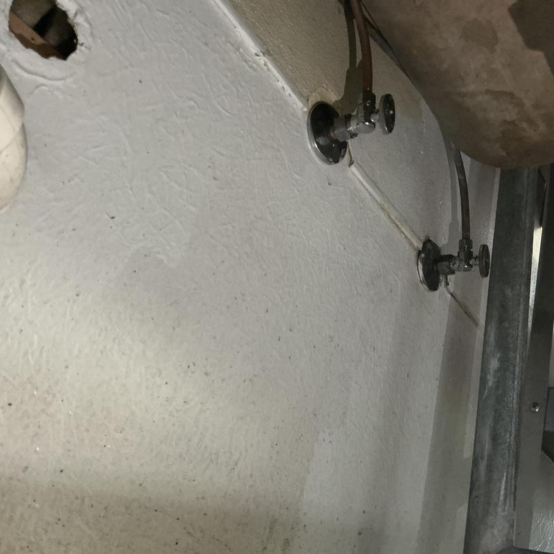 Angle stop valves on bathroom wall with water damage Angle stop valves on bathroom wall with water damage