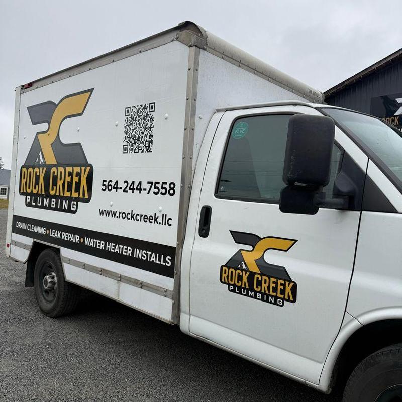 Plumbing service truck with Rock Creek Plumbing logo