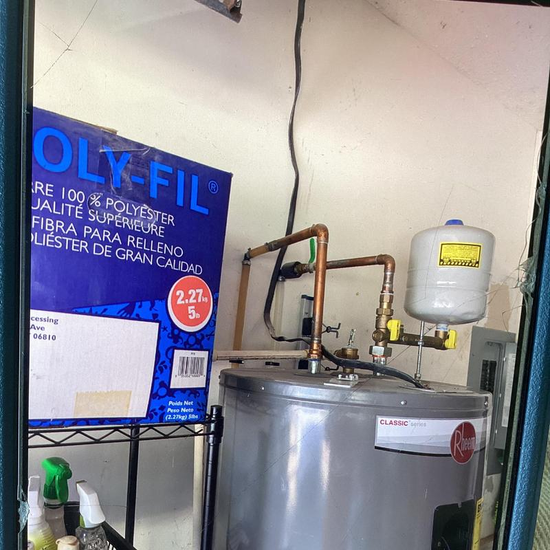 Rheem electric water heater with copper piping and expansion tank
