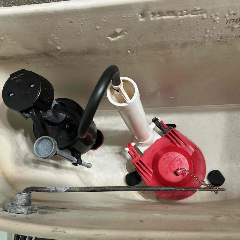 Toilet fill valve and flapper installation inside tank