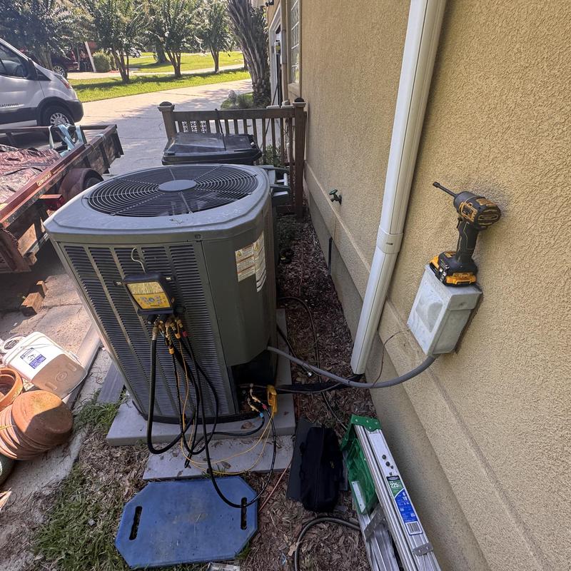 Split system air conditioner with refrigerant gauges