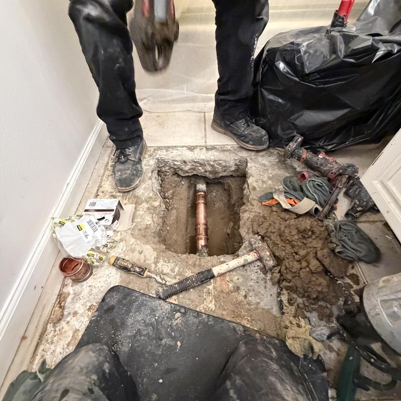2 inch copper pipe exposed in concrete floor hole