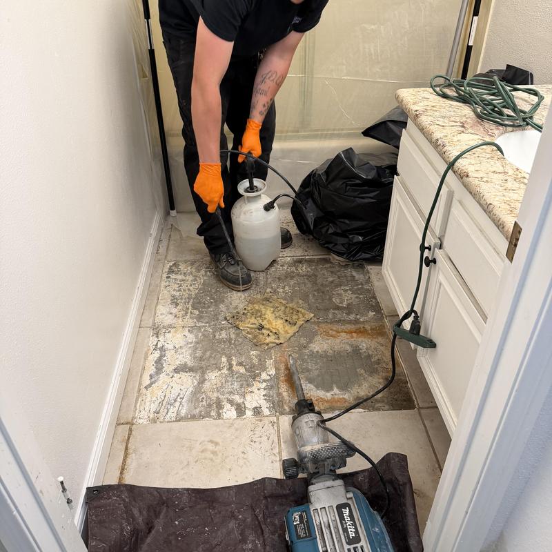 Concrete floor exposed for copper pipe replacement